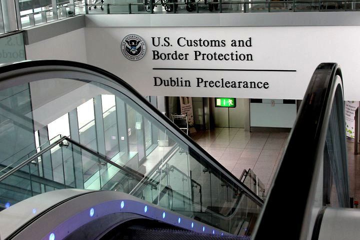 Customs notice above escalator