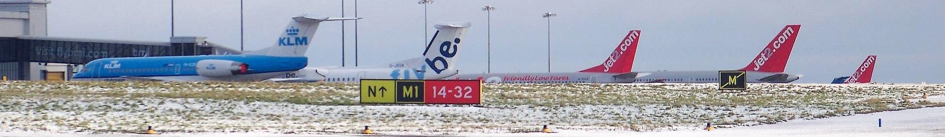 Planes in the snow at airport