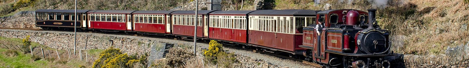 Historic rail carriages on track
