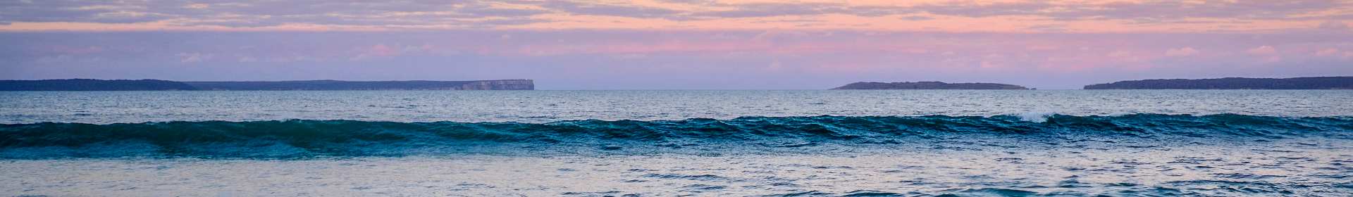 A breaking sea at sunset